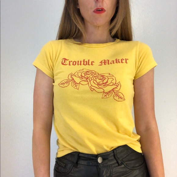 yellow shirt with red writing